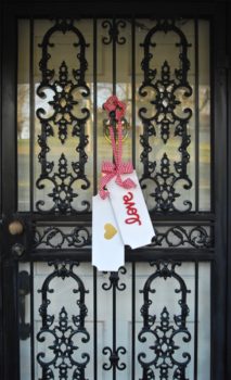 Make decorating your front door for Valentine's Day and St. Patrick's Day easy with these DIY reversible door tags.