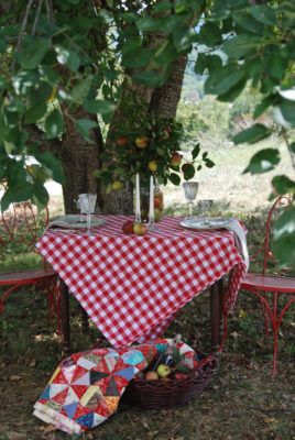 Feel inspired by this rustic and refined orchard tablescape. Set the table for two with elegant tableware and rustic elements. Use apples as your centerpiece.