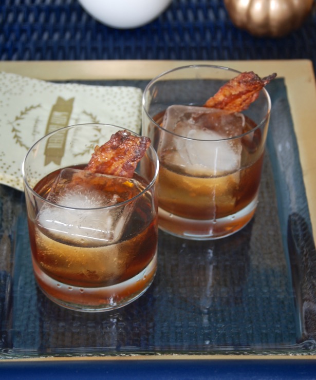 Wow Thanksgiving guests with a maple bourbon cocktail garnished with candied bacon