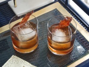 The perfect Thanksgiving cocktail - a maple bourbon cocktail with candied bacon