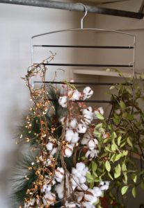 Try these 5 holiday storage hacks to organize your Christmas decor. Hang wreaths, flags, and garland.