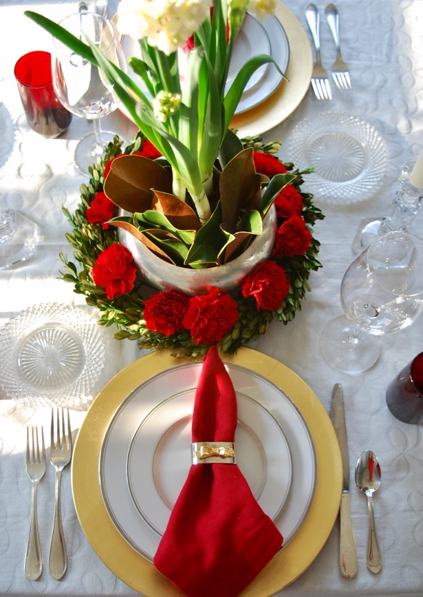 Set an elegant red and white Christmas table with paperwhite centerpiece, boxwood, and magnolia for Christmas dinner