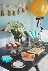 Invite girlfriends over for a glamorous Golden Globes party. Get inspired with these party ideas featuring DIY popcorn cones, gold balloons, and tassel garland.