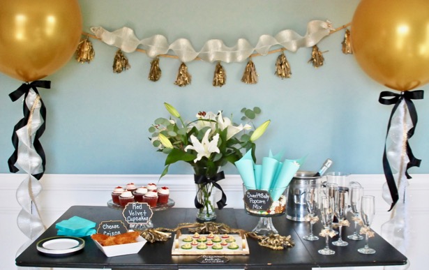 Invite girlfriends over for a glamorous Golden Globes party. Get inspired with these party ideas featuring DIY popcorn cones, gold balloons, and tassel garland.