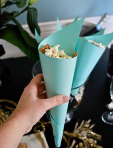 Make a sweet and salty popcorn mix using SkinnyPop's naturally sweet popcorn for a great party snack.