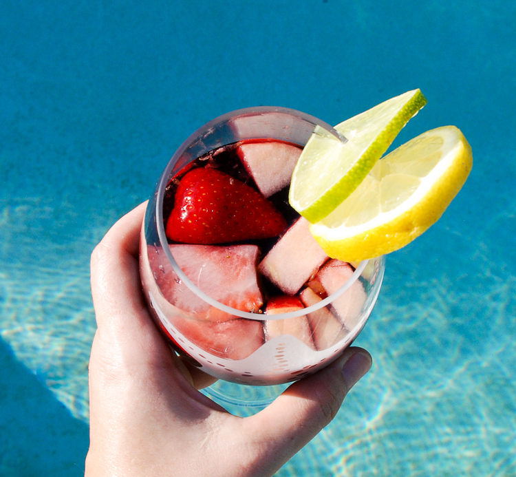 Pool party with sangria pitcher, fruit cocktails and refreshments