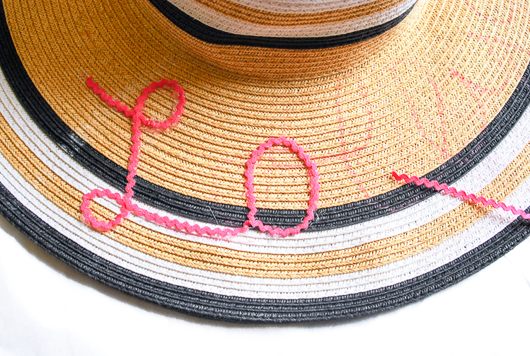A little bit sassy, a whole lot of Southern this DIY rick-rack script sun hat is perfect for lazy days at the beach or pool!