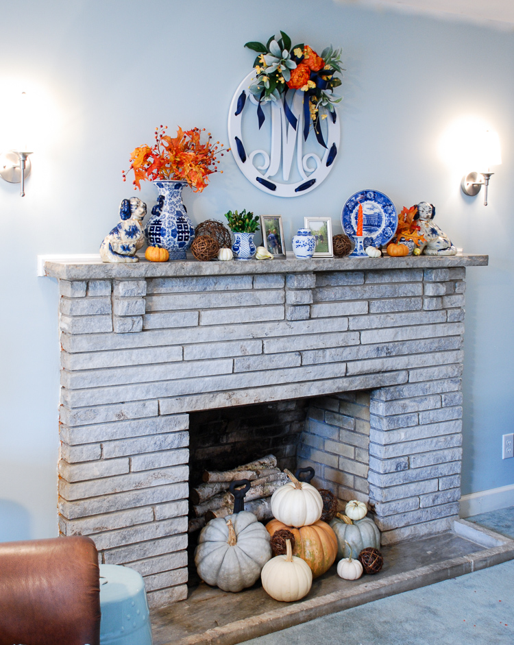 Decorate for autumn with a cheery blue and white fall mantle adorned with mini pumpkins, fall foliage, Staffordshire spaniels, monograms, and blue and white china!