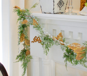 Poinsettia, juniper, paper whites, velvet ribbon, and gold accents mingle merrily in my green & gold Christmas living room!
