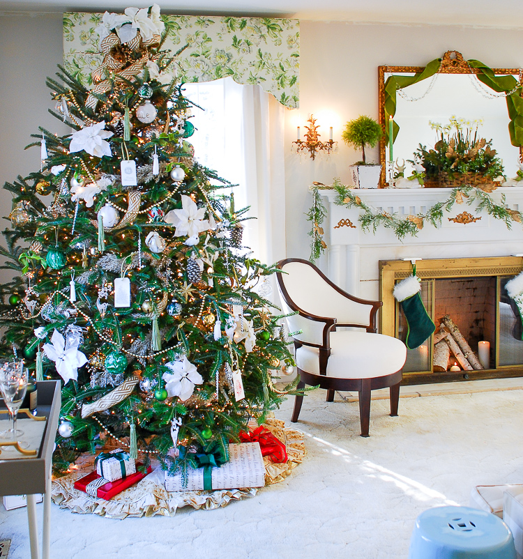 Elegant Christmas Tree with Poinsettias and Festive Decor