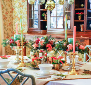 Embrace the unexpected this holiday season with a whimsical-glam Christmas table bedecked with mixed metals, pink and green hues, Arté Italica dinnerware, poinsettia, and fanciful ornaments.