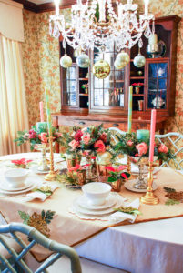 Embrace the unexpected this holiday season with a whimsical-glam Christmas table bedecked with mixed metals, pink and green hues, Arté Italica dinnerware, poinsettia, and fanciful ornaments.