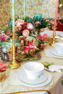 Embrace the unexpected this holiday season with a whimsical-glam Christmas table bedecked with mixed metals, pink and green hues, Arté Italica dinnerware, poinsettia, and fanciful ornaments.