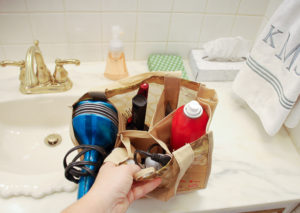 Repurpose grocery store wine totes as storage caddies to organize your closet, bathroom, and suitcase!