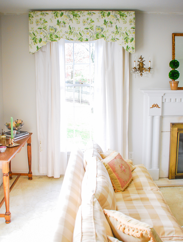 Gingham and chintz harmonize in this traditional living room for a bright and airy space that is full of Chinoiserie details and Southern charm.