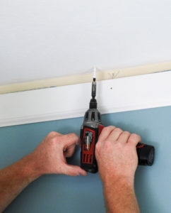 Set anchors to secure DIY crown molding to ceiling