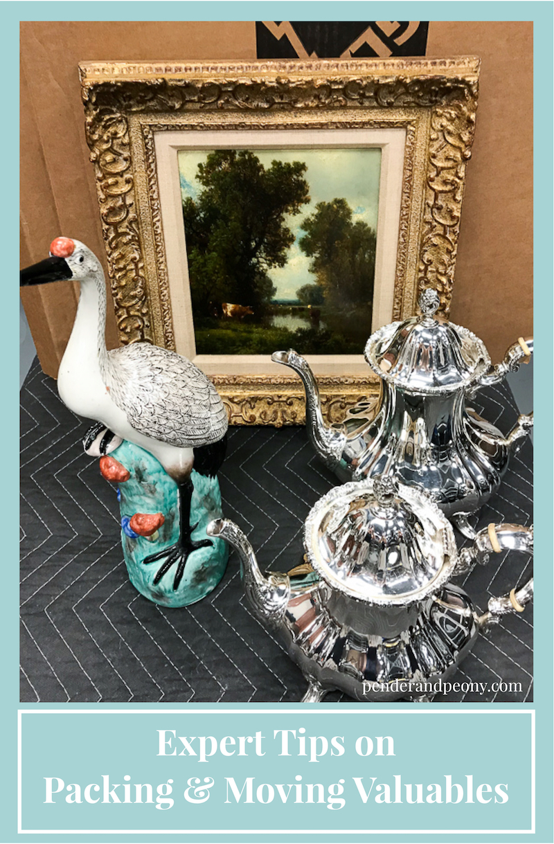 Array of silver, art, and ceramics on table. Learn how to pack and move these valuables.