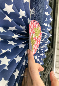 DIY patriotic rosette showing glued circle and stars detail