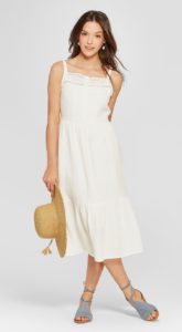 Woman wearing a white eyelet maxi dress
