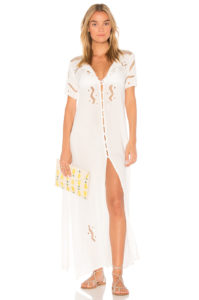 Woman wearing a white eyelet maxi dress