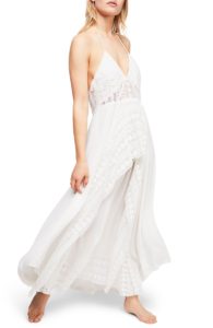 Woman wearing a white eyelet maxi dress
