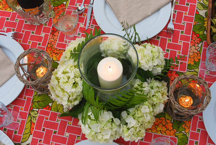 hydrangea centerpiece with glass hurricane and white candle