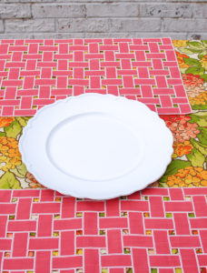 Step 1 to create hydrangea centerpiece lay white plate on table