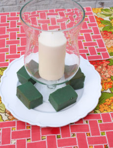 Step 4 to create hydrangea centerpiece - place floral foam around glass hurricane