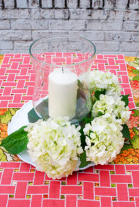 Step 6 to create hydrangea centerpiece - add hydrangea around hurricane