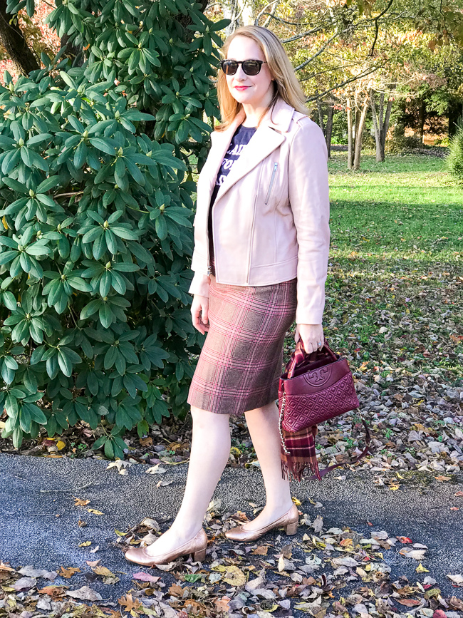 Blonde woman wearing plaid skirt - one of the 5 winter plaid pieces you need in your wardrobe
