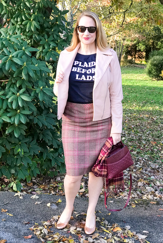 Blonde woman wearing graphic tee, plaid skirt, moto jacket for 5 winter plaid pieces you need in your wardrobe