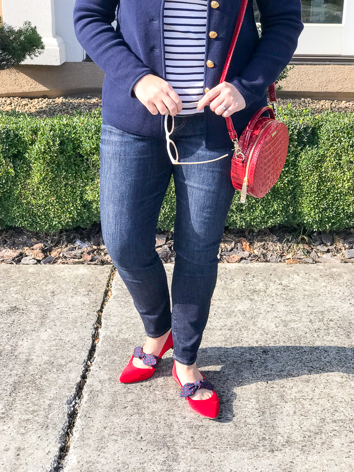 Red pointed toe flats in crushed velvet with bows and red circle bag pair perfectly with navy jacket and striped shirt for a red loves navy look