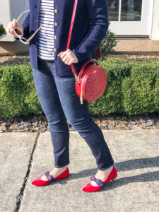 Red circle crossbody bag with red pointed toe flats