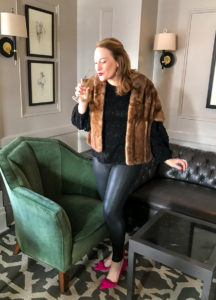 Blonde woman in black and sparkly going out look for NYE