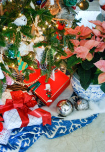 Pretty presents tied up with bows under a preppy & plaid Christmas tree