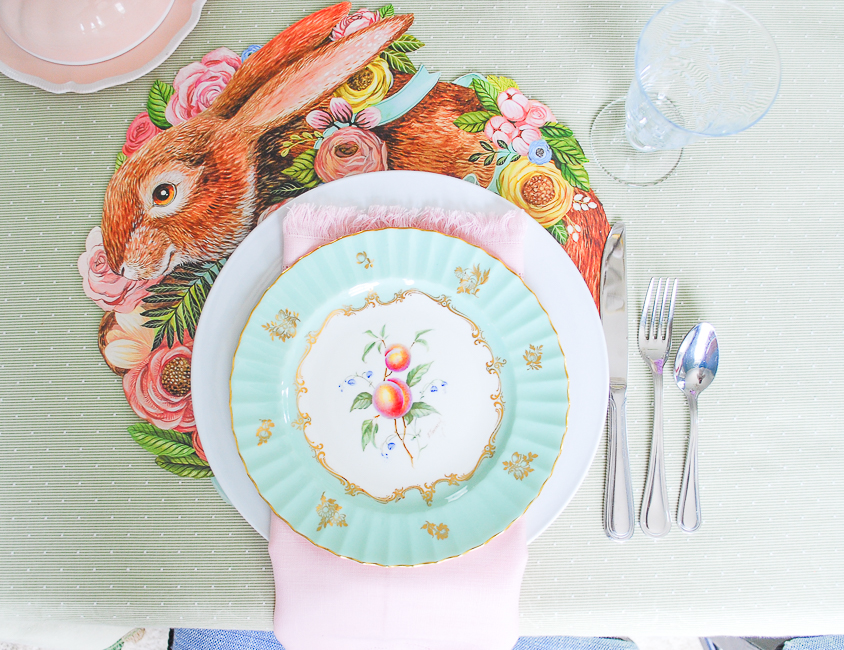 Easter brunch table place setting with Hester & Cook bunny placemats and Royal Worcester antique china and pale pink napkin