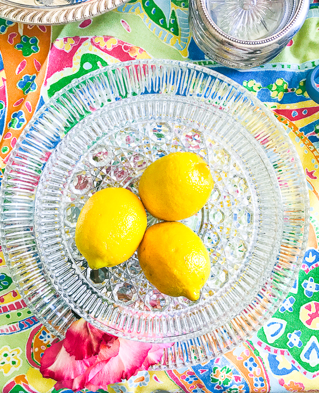 Use a fruit centerpiece like lemons in a glass bowl - 5 summer table styling tips