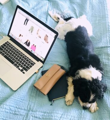 Open Apple computer with Henry the Cavalier King Charles Spaniel and my Labor Day sales picks