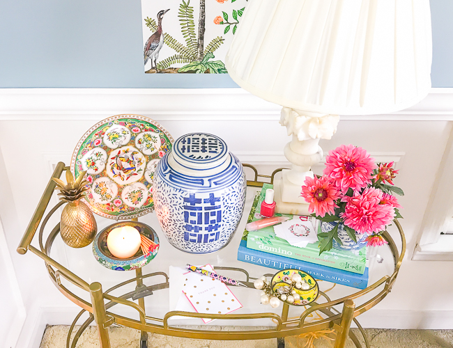Chinoiserie look for less - ginger jar, butterfly plate, brass pineapple on bar cart