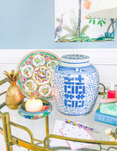 Chinoiserie look for less - ginger jar, butterfly plate, brass pineapple on bar cart