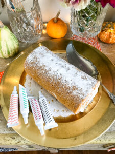 Decorate a pumpkin spice roll with an icing web for that spooky feel