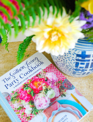 Southern Living Party Cookbook beside ginger jar vase of dahlias