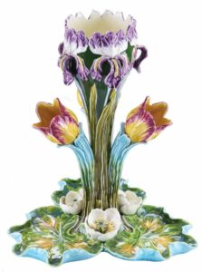 Ceramic centerpiece with iris and tulip forms.