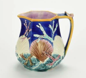 Majolica pitcher with seashells and seaweed.