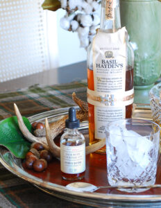 Close up view of the bottles of Basil Hayden and Jack Rudy Bitters