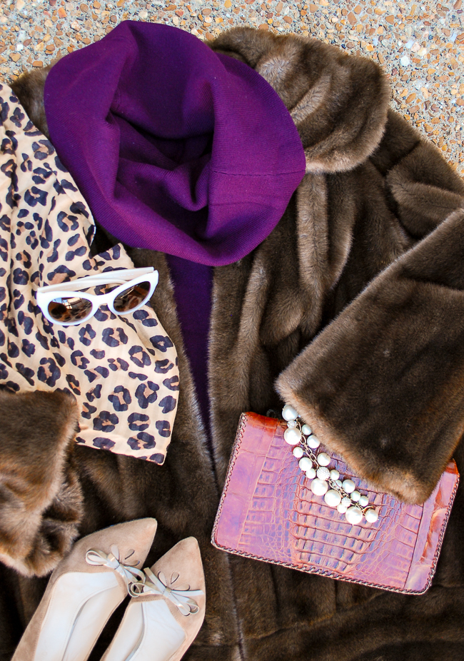 The fashion color story I'm obsessed with for fall: violet and chocolate - illustrated in this flat lay with purple sweater, fur coat, and leopard print scarf