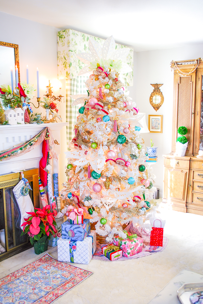 Elegant Christmas Tree with Poinsettias and Festive Decor