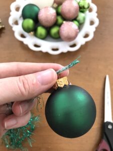 wrap scotch tape around end of yarn to make threading easier