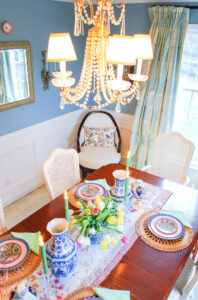 Elegant crystal chandelier in grandmillennial style dining room