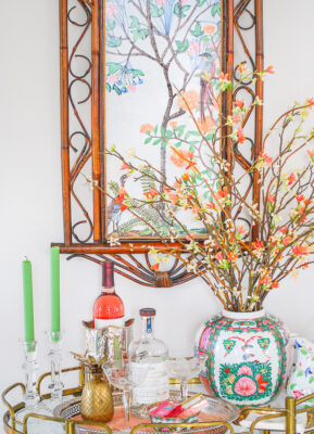 DIY Chinoiserie panel above vintage brass bar cart with rose medallion, crystal, and antique silver